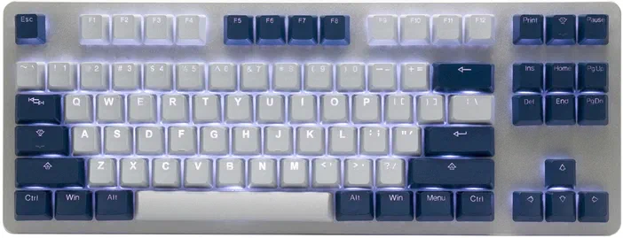 Clavier mécanique avec touches blanches et bleues sur fond gris clair