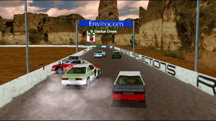 Une capture d'écran du jeu vidéo Destruction Derby montrant plusieurs voitures en collision sur une piste de course dans un décor rocheux.