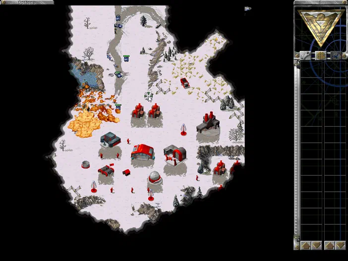 Capture d'écran du jeu vidéo Alerte Rouge, montrant une carte de combat enneigée avec des unités et structures rouges déployées.